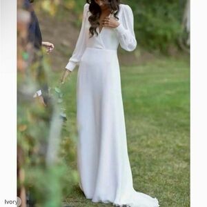 Wedding dress. Elegant. Chiffon style with classy V back detail. Never worn.